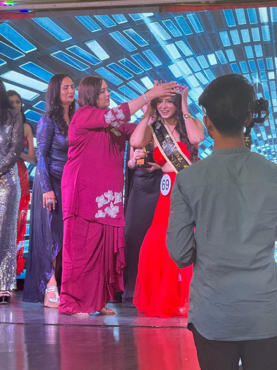 Dr. Purva at a beauty pageant award ceremony