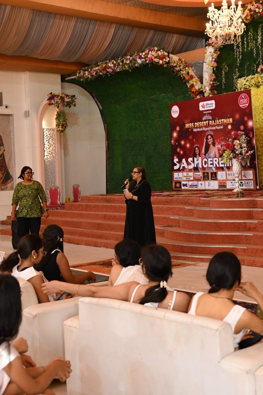 Dr. Purva speaking at the Miss Desert Rajasthan sash ceremony